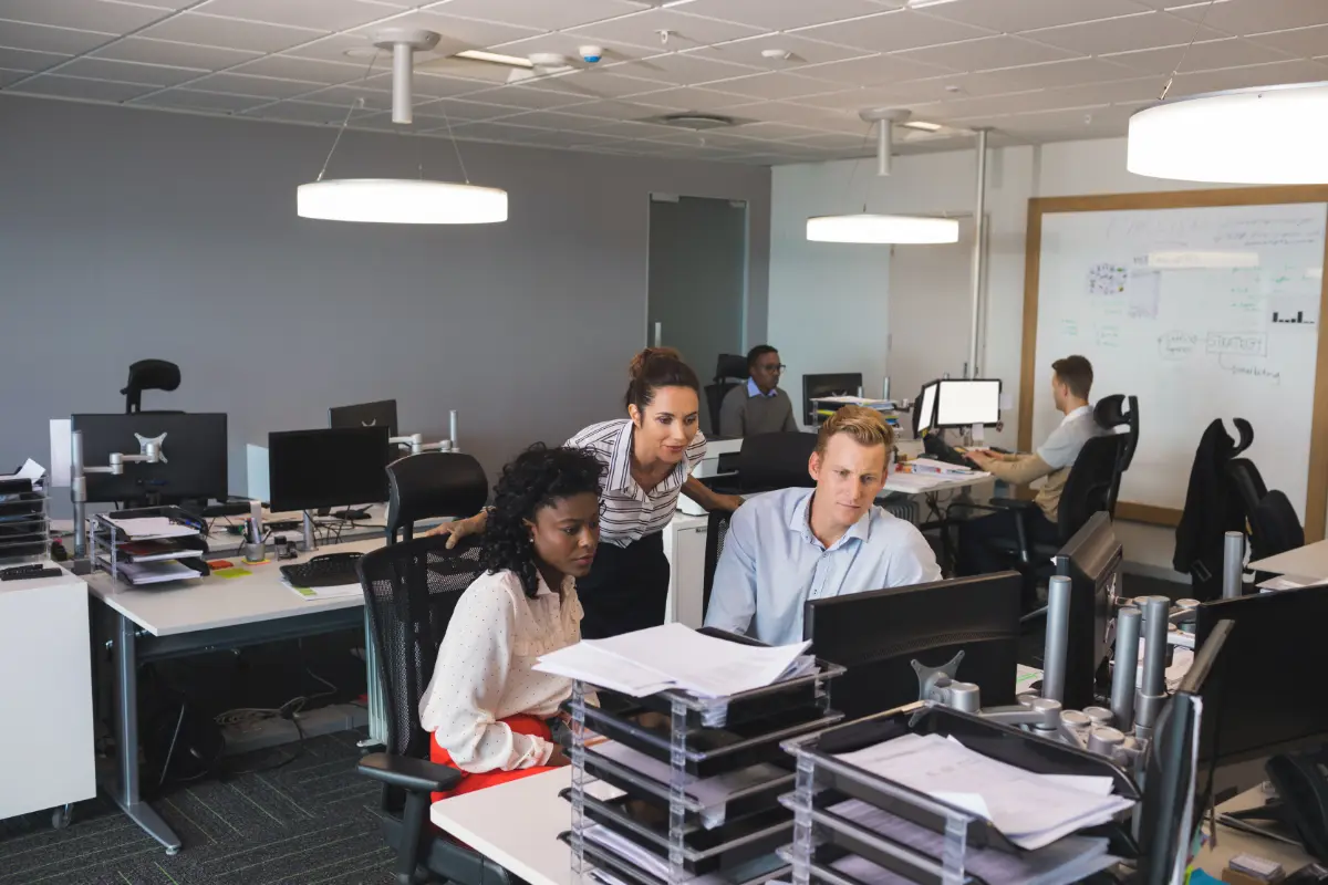 Business colleagues discussing at desk