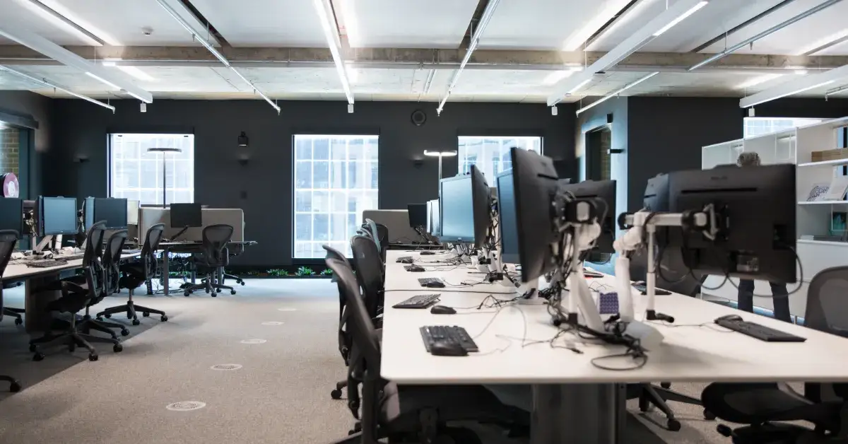 large open office with lots of desktop computers